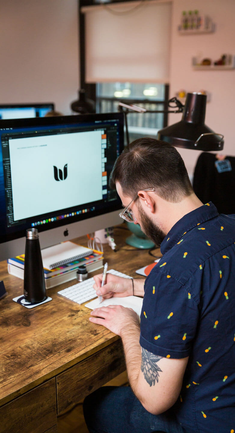 Art Director Bruce Viemeiester sketching logo