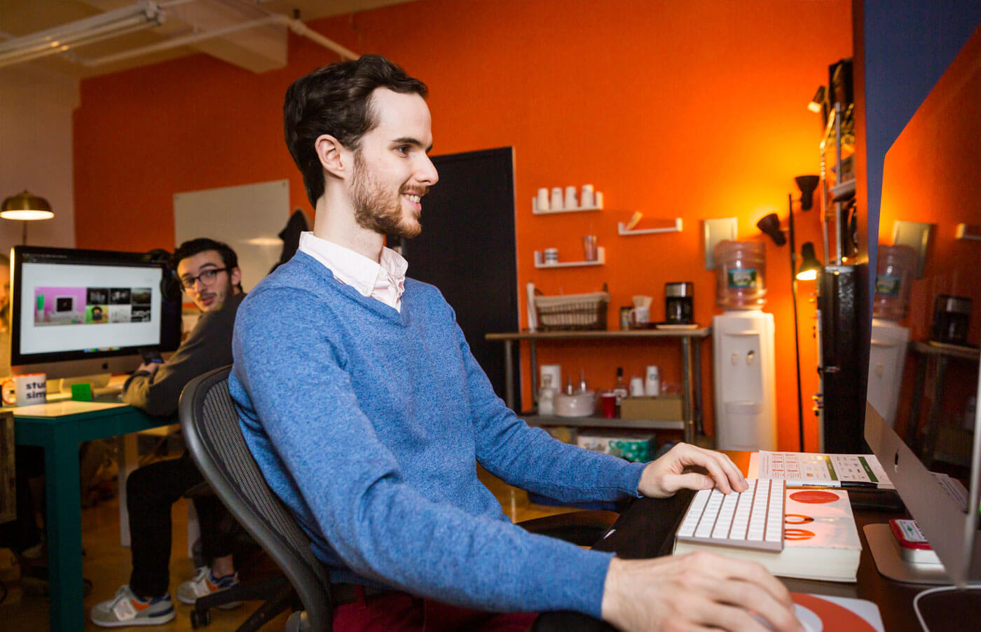 Developer Evan Thompson working at computer