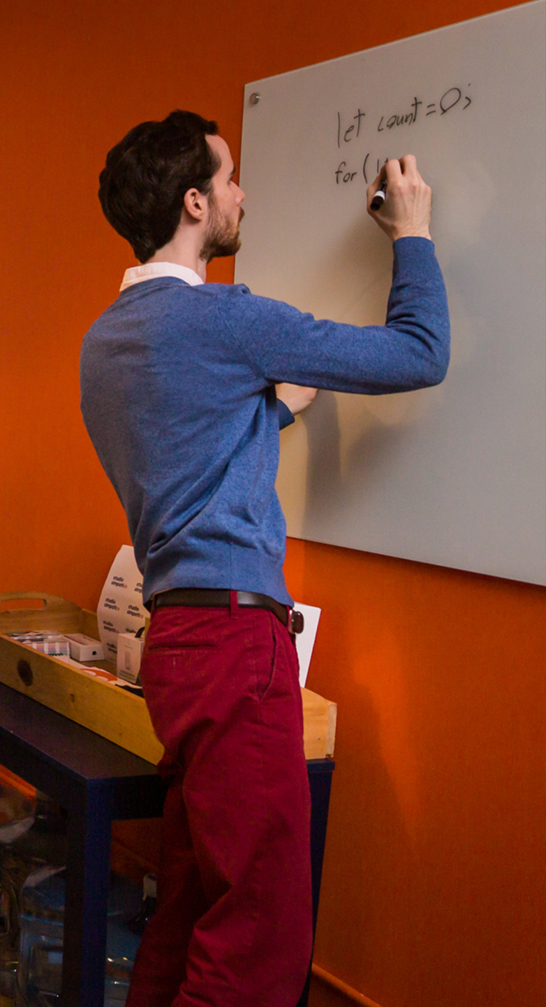 Evan writing on whiteboard