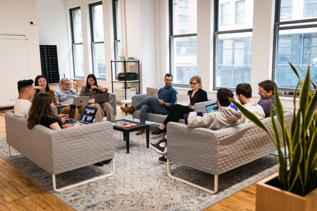 Team Sitting Around Sofa