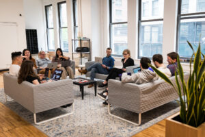 Team Sitting Around Sofa